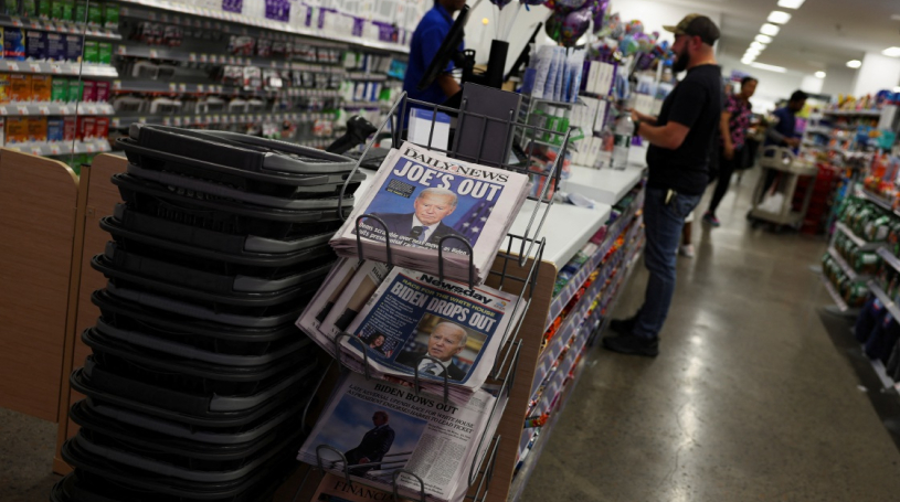 Copies of newspapers after US President Joe Biden announced that he is dropping his reelection bid. REUTERS/Shannon Stapleton